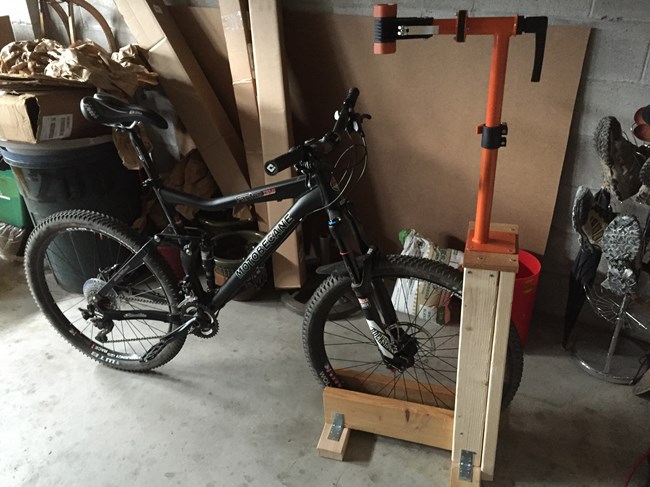 DIY Bike Rack and Stand holding front wheel of bike